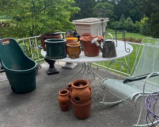 pots and wrought iron table and rocker 