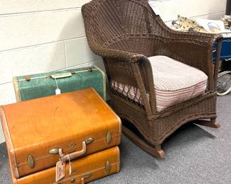 vintage luggage and wicker rocker 