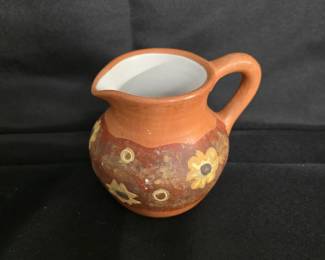small ceramic pitcher