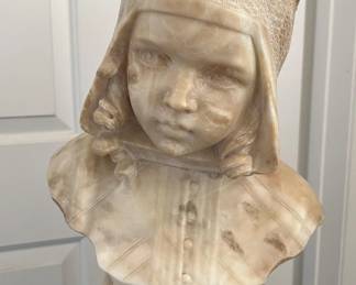 Here we have a carved bust made from Carrara marble.