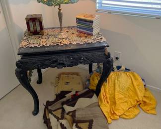 The lamp is certainly a Tiffany-style. Come see it up close and in greater detail. One of the many rugs is here, as well as the table.