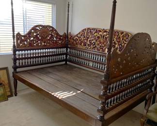 This is a rather large four-poster day bedframe. Full-size? That's what it seems to be.