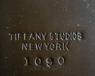 Just in case, it reads "TIFFANY STUDIOS NEW YORK 1090"