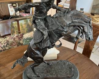 The signature on the base says, "Remington".