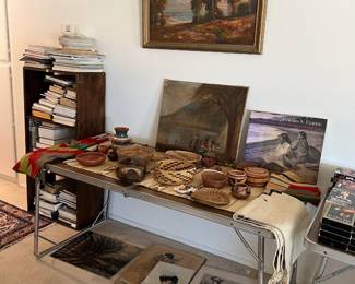 This photo shows a few of the framed art, along with several other decorative baskets, bowls, and plates