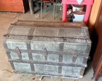 Antique metal-bound steamer trunk