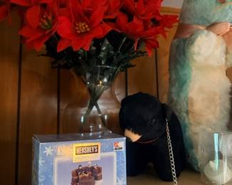 Poinsettia arrangement and stuffed animal toys