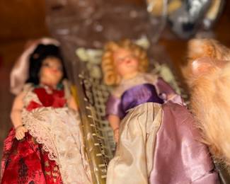 Vintage collector porcelain dolls in fancy dresses