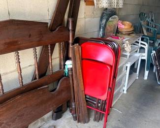 Wooden bed frame and folding chairs