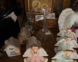 Angel figurines with religious cross and icon