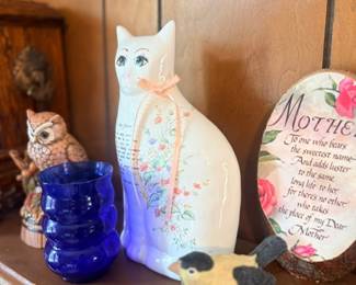 White ceramic cat figurine & cobalt vase