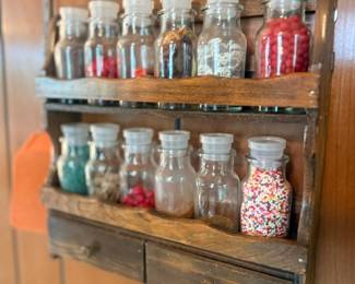 Wooden wall spice rack with glass jars