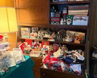 Wooden hutch cabinet filled with collectibles