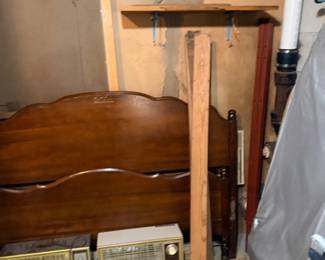 Wooden bed headboard and vintage space heaters