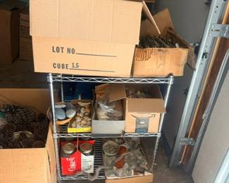 Boxed garage items on wire shelving unit