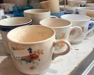 Assorted vintage floral china teacups row