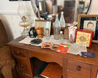 Antique wood desk with oil lamp & vintage bottles