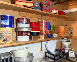 Vintage tins and cookware on shelf