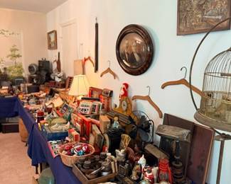 Vintage collectibles lot — antique brass birdcage, convex bullseye mirror, lanterns, lamps