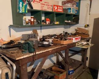 Workbench with tools and garage hardware