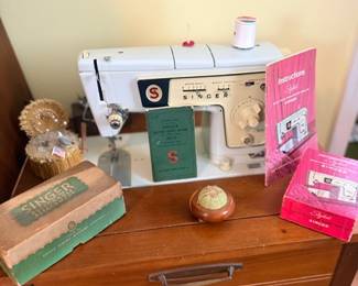 Vintage Singer sewing machine in cabinet table