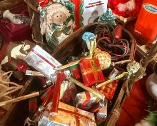 Basket of wrapped Christmas gift boxes and decor