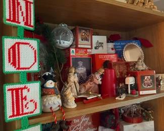 NOEL needlepoint decor and shelf of Christmas figurines