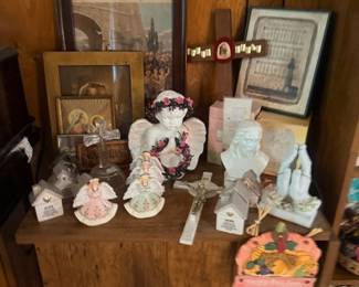 Wood side table with framed art and figurines