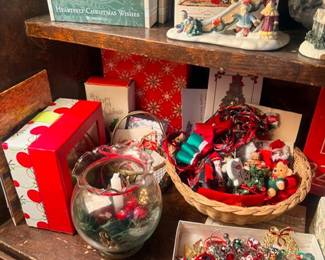 Christmas village figurines on wood shelf
