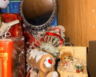 Ornate small mirror and plush reindeer decor