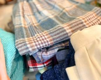 Stack of vintage folded plaid clothing