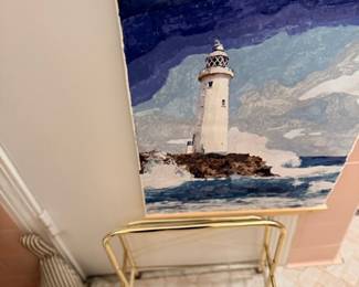 Framed lighthouse painting & brass serving cart