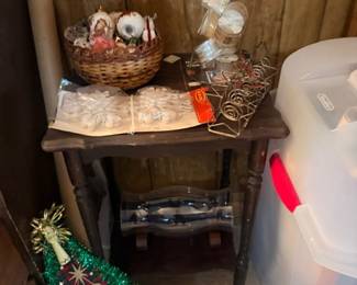 Wooden side table with holiday decor items
