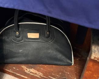 Black leather handbag purse with gold nameplate