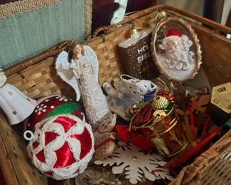 Basket of Christmas ornaments and angel figure