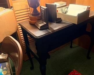 Wood writing table with lamp and books