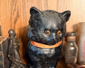 Vintage black cat figurine bank with glass eyes