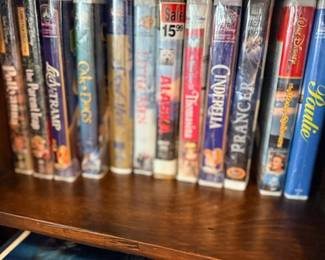 Collection of VHS tapes including Disney movies