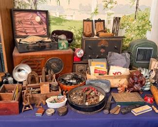 Table of vintage smalls — wooden boxes, cameras, tins & carved figures