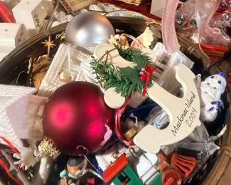 Basket of assorted Christmas ornaments and decorations