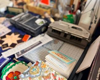 Table of vintage craft supplies & collectibles