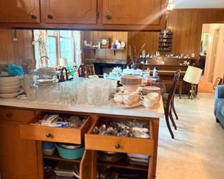 Kitchen cabinets full of dishes & flatware