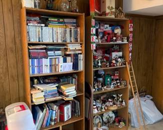 Bookshelf with books, collectibles and step ladder