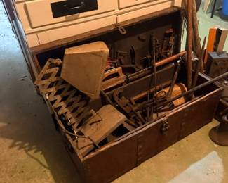 Vintage wooden tool chest with hand tools