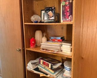 Wooden bookshelf cabinet with books and decor