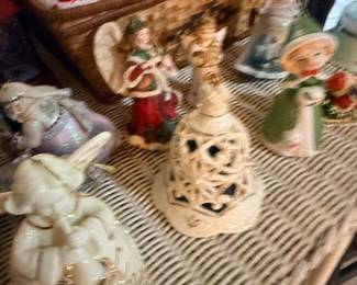 Porcelain filigree vase and figurines on wicker table