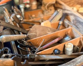 Wooden crate of vintage hand tools — saws, files & chisels