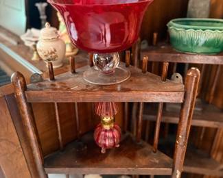 Red glass compote & pink glass on shelf