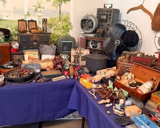 Vintage table lot — cameras, radios, electric fan, cast-iron & tins