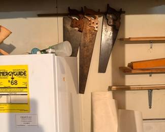 Vintage hand saws and small chest freezer